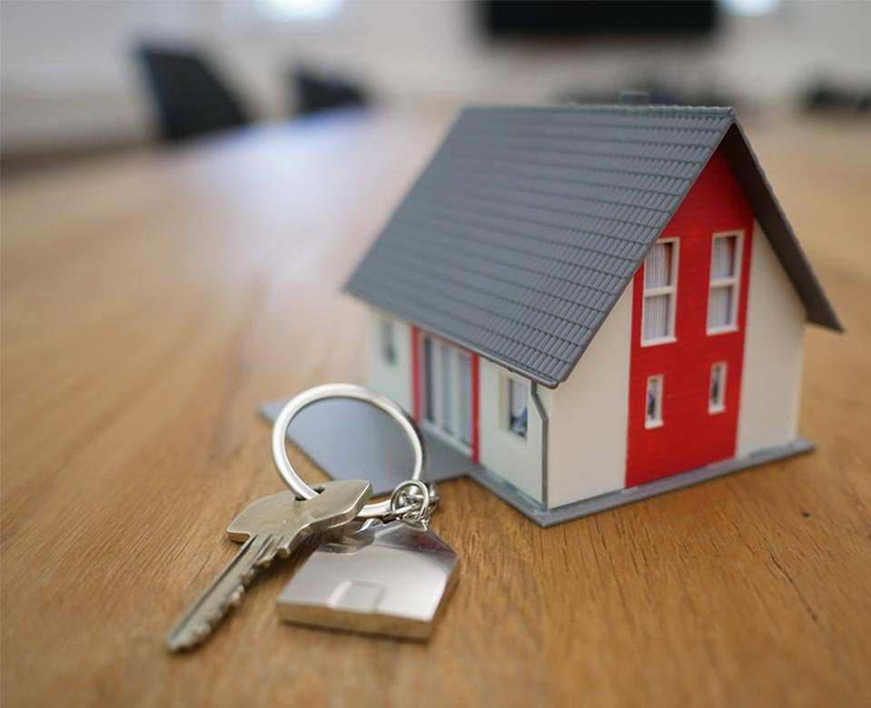 Illustrative house model and keys on a table
